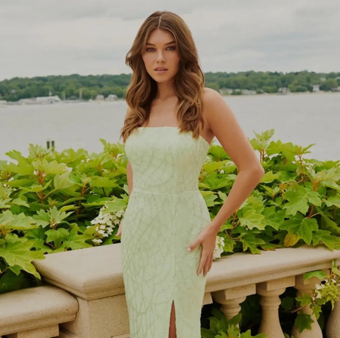 Model wearing a blue prom dress